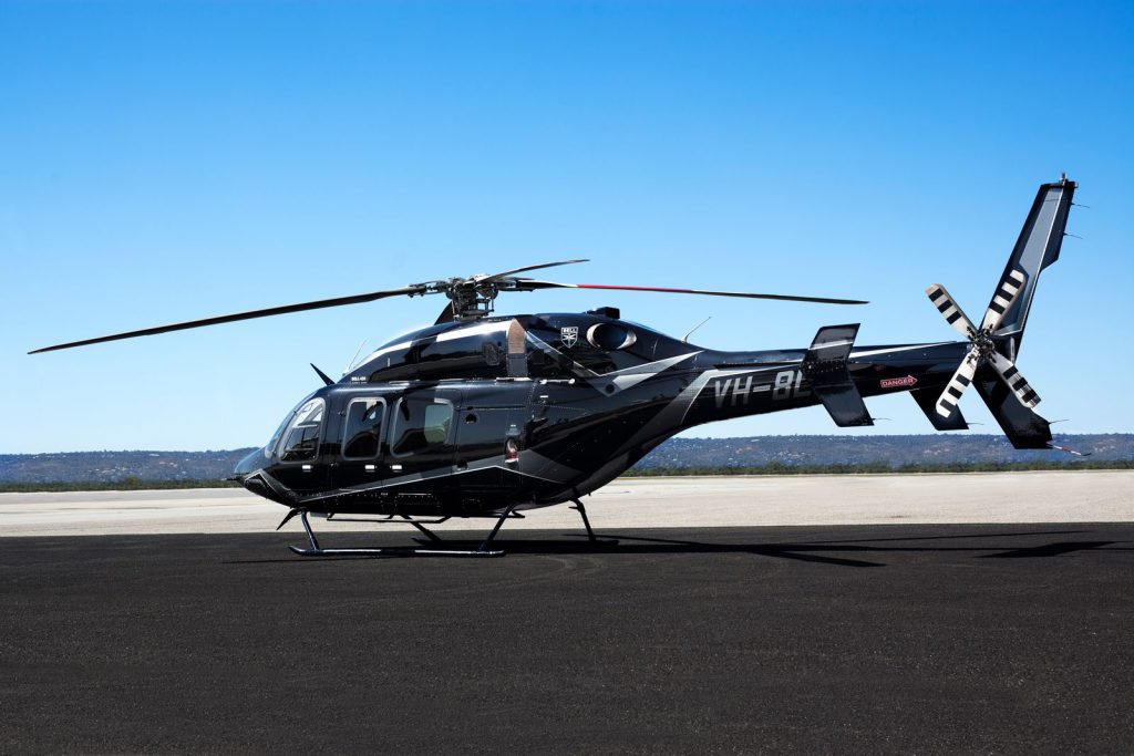 Bell 429 Helicopter used for mining and government charter flights sitting on the tarmac at an Australian airport.